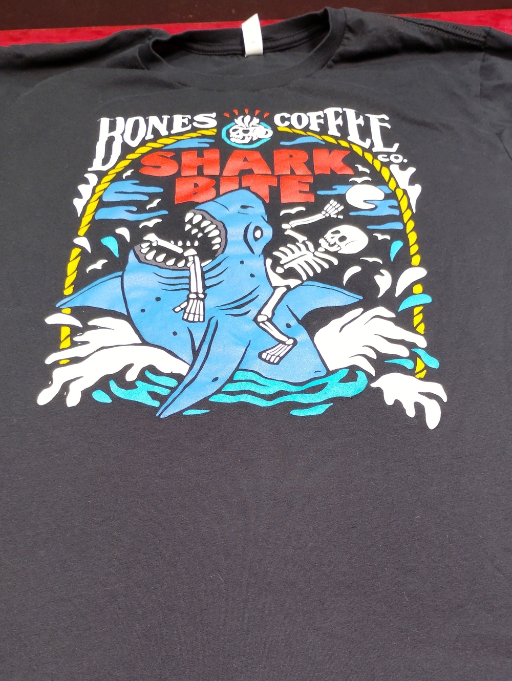 Bella Canvas Black Tee with Blue Shark Bite Graphic and Red Text